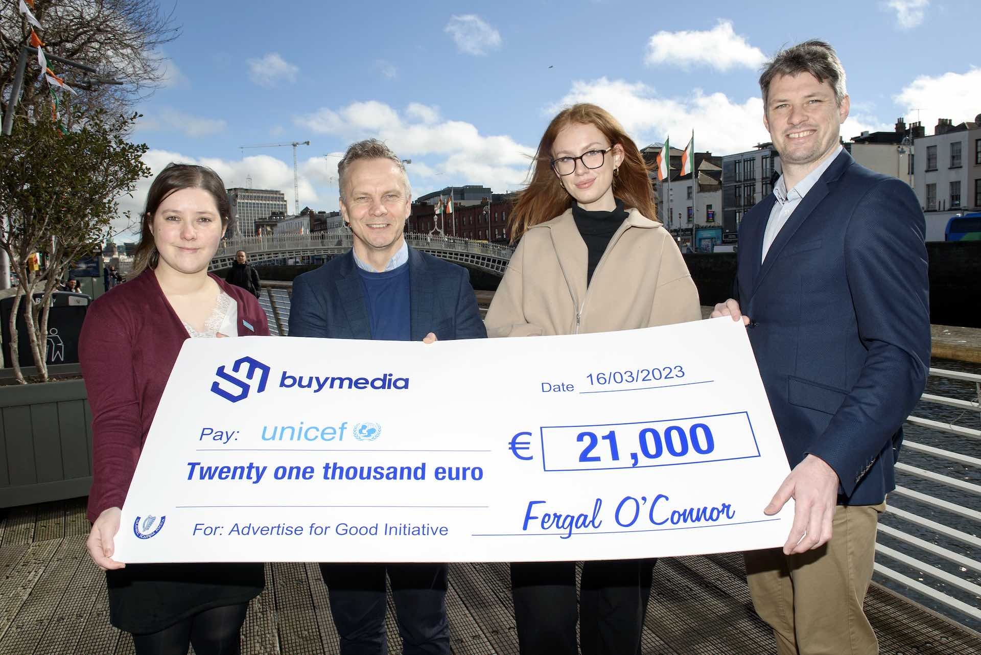 Buymedia staff presenting a donation cheque to UNICEF Ireland